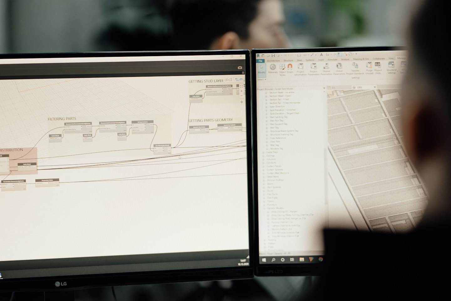 Portfolio Two computer screens showing architectural software in an office.